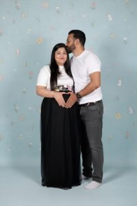 Modern maternity studio photoshoot in Faridabad – luxury indoor pregnancy photography by Alok Color Lab with premium lighting and outfits.