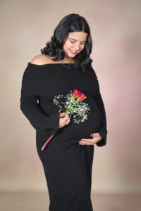 Best maternity photoshoot capturing an expecting couple with elegant poses and natural emotions by Alok Color Lab