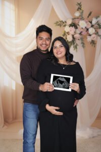 Best maternity photoshoot of expecting parents with creative poses and emotional moments captured by Alok Color Lab